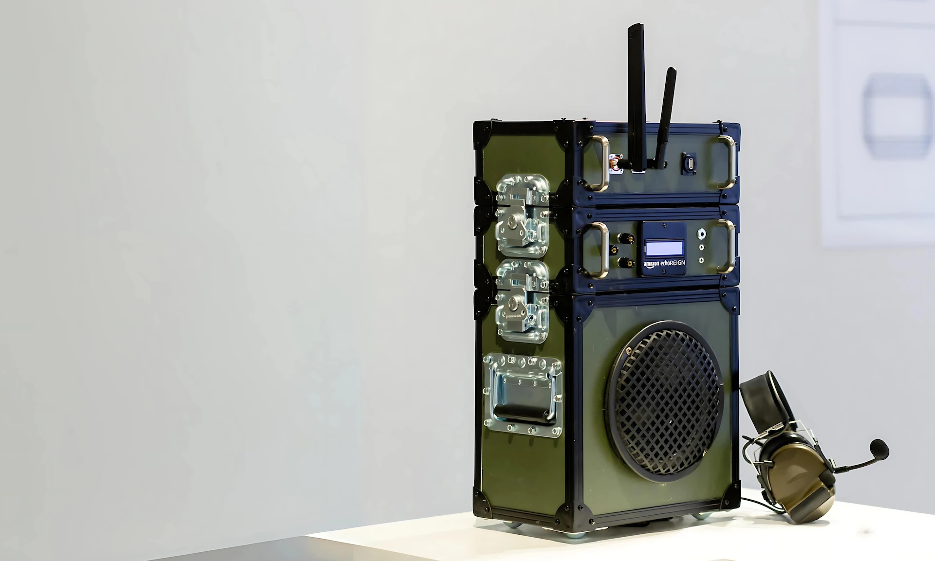 Detail view of the Echo REIGN device, a green military smart speaker